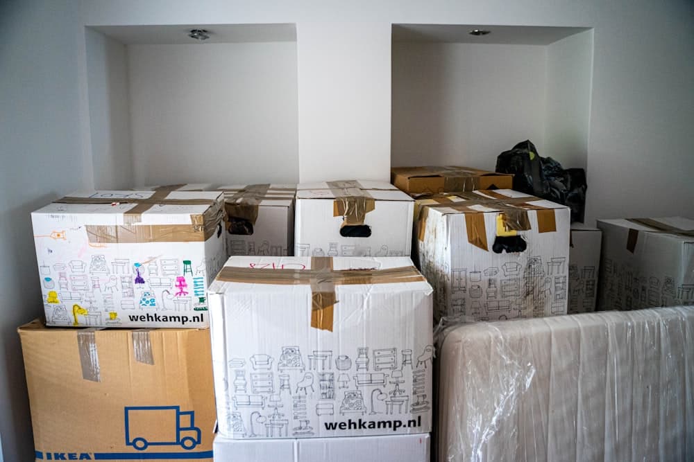 Stacked and labelled moving boxes ready for a house removal in Manchester